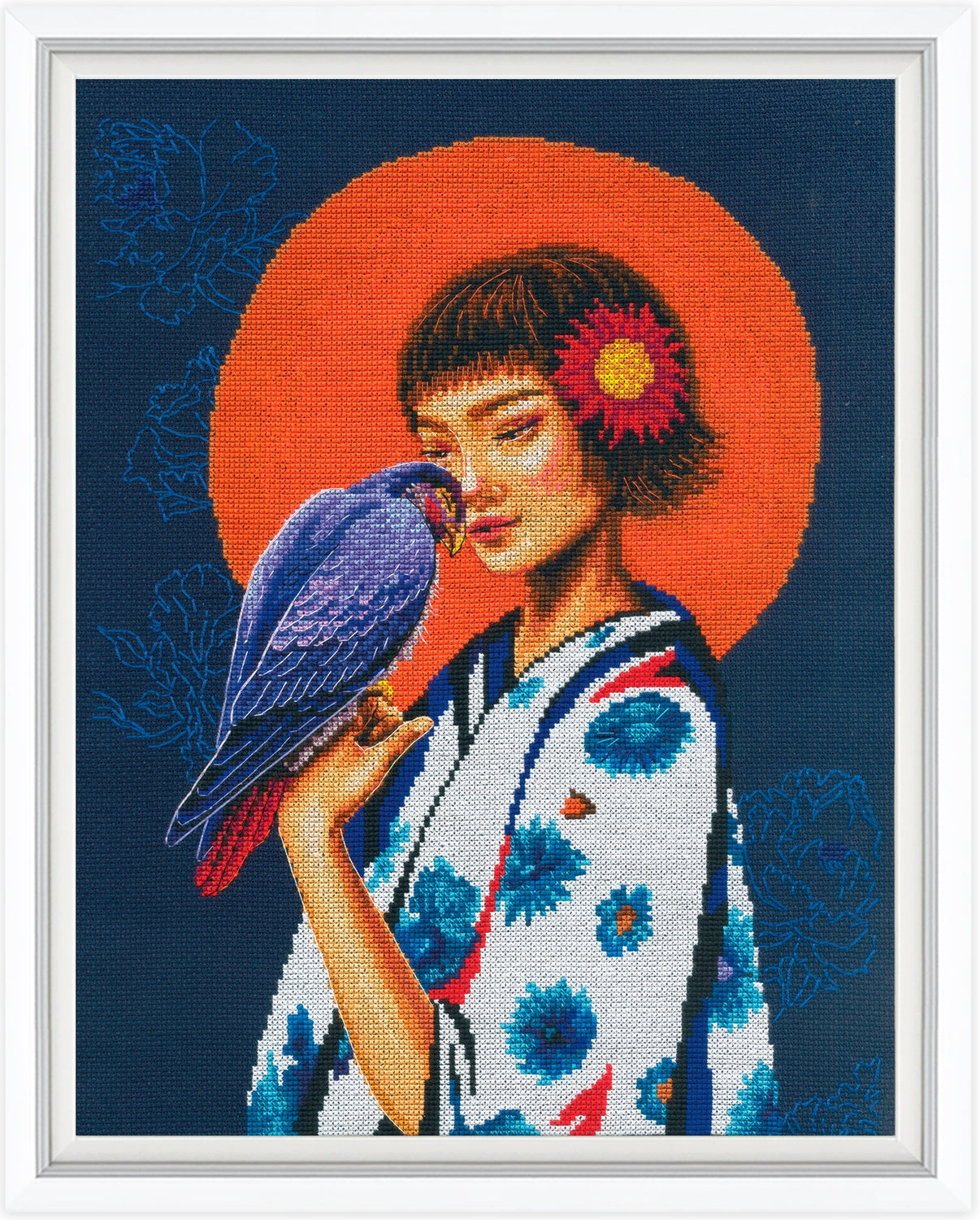 Cross-stitched artwork of a woman with a parrot and floral design