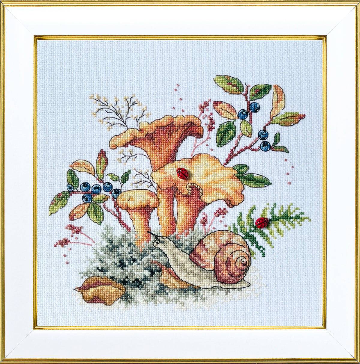 Chanterelles cross stitch kit framed finished piece with mushrooms, blueberries, snail and ladybug